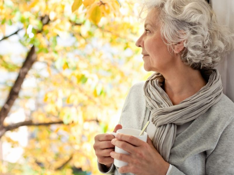woman-drinking-tea-looking-out-window